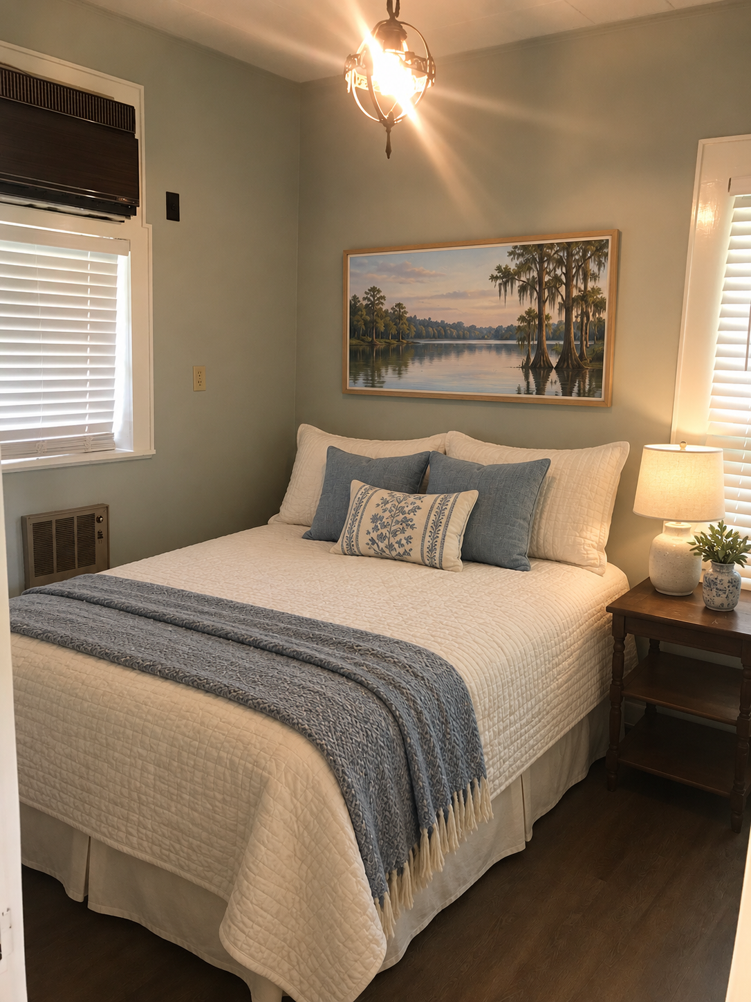 Second guest bedroom with queen bed in soft green tones