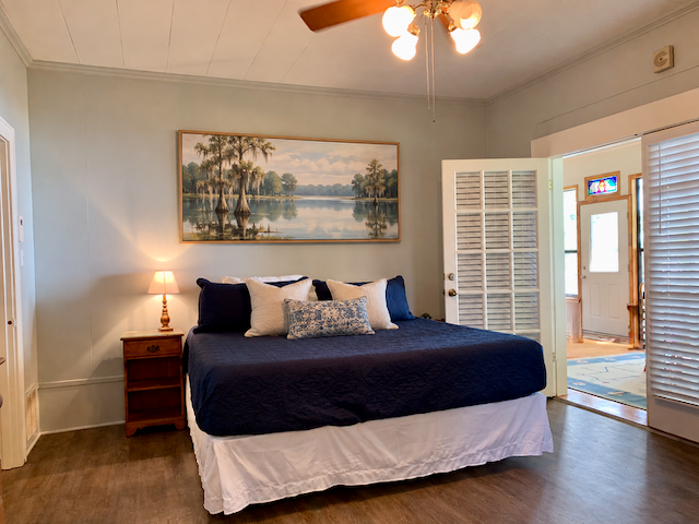 Master suite with king bed and lake artwork